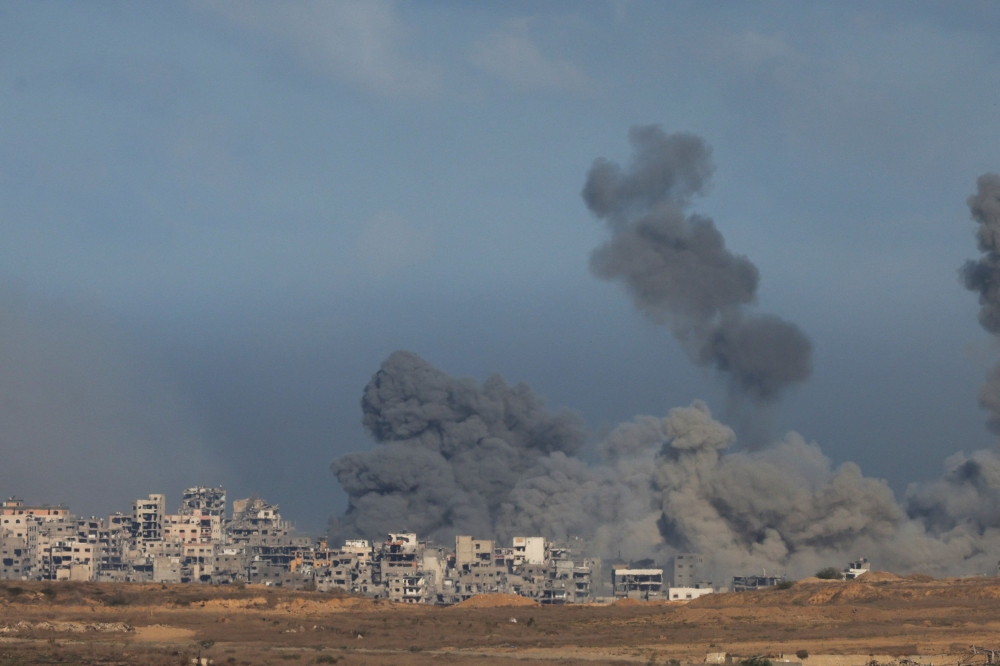 Plumes of smoke rise from explosions in Gaza, as seen from southern Israel, October 7, 2025. — Reuters pic