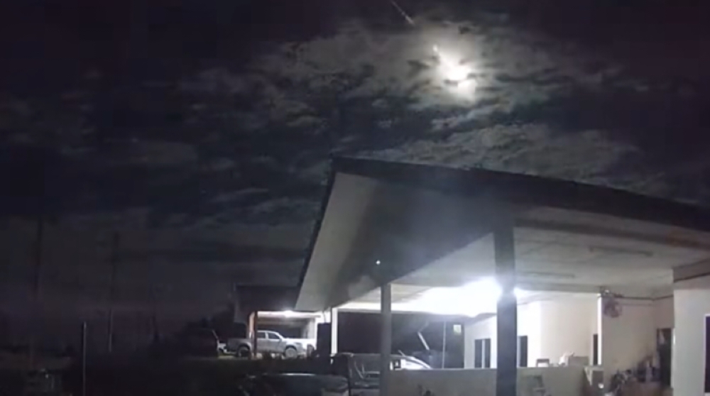 Screenshot from dash cam footage from a local resident shows a bright object streaking across the sky.