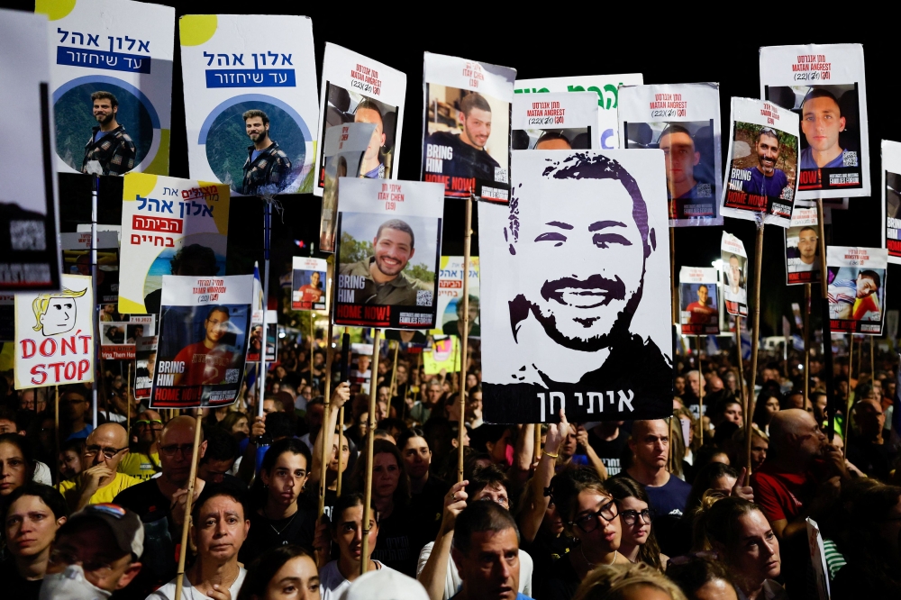 Demonstrators rally ahead of the two-year anniversary of the deadly October 7, 2023 attack on Israel by Hamas, and to demand the immediate release of all hostages and the end of war in Gaza, in Tel Aviv October 4, 2025. — Reuters pic 