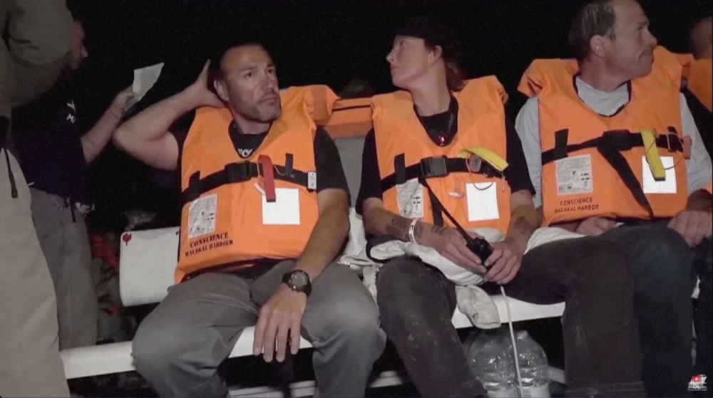 Crew of ‘Conscience’, a Gaza-bound vessel which is part of the Global Sumud Flotilla, sit aboard the boat as they are intercepted by Israeli security forces, in this screengrab obtained from a video released on October 8, 2025. — IHH handout pic via Reuters 