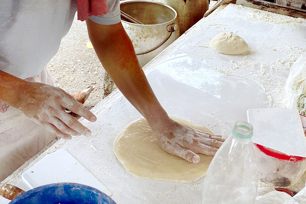 The Yau Char Kwai Sifu works swiftly to shape the dough. — Picture by CK Lim