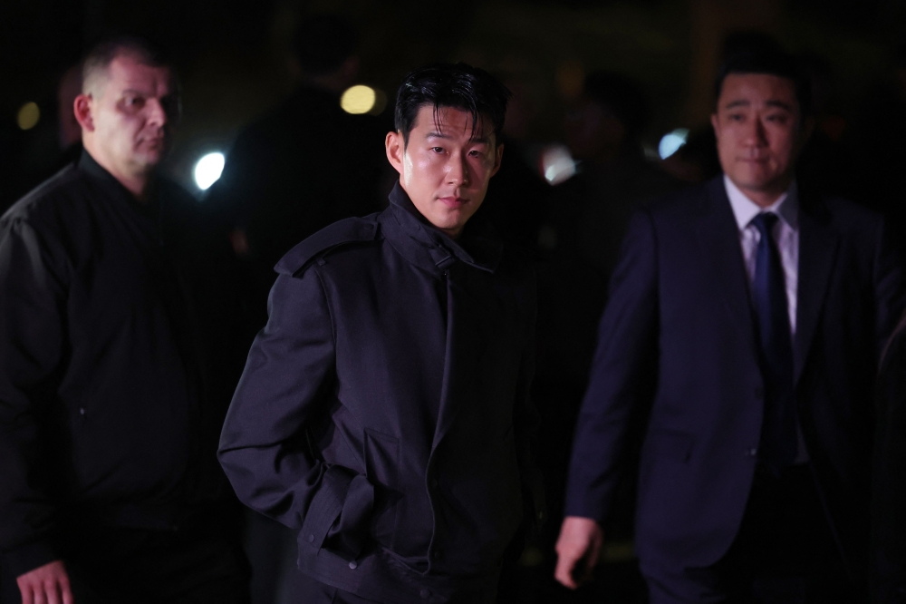 Tottenham and South Korean footballer Son Heung-min (centre) arrives to attend the catwalk presentation for British fashion house Burberry's Autumn/Winter 2024 collection, at London Fashion Week in London February 19, 2024. — AFP pic