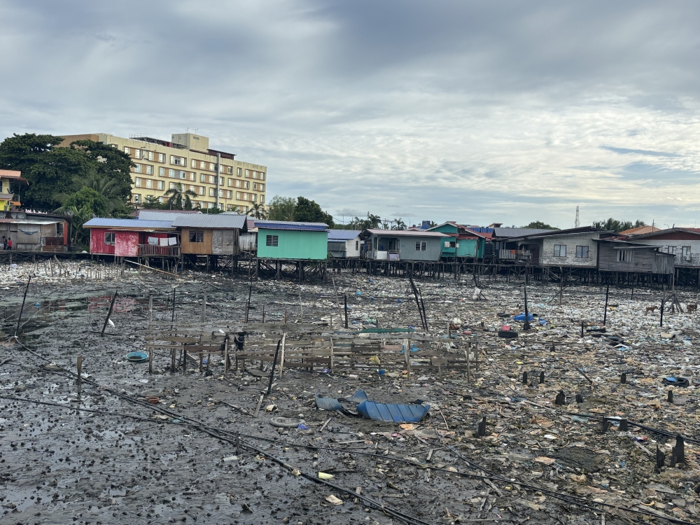 With limited rubbish collection at sea, waste from nearby islands often ends up floating into Semporna’s waters. — Picture by Julia Chan