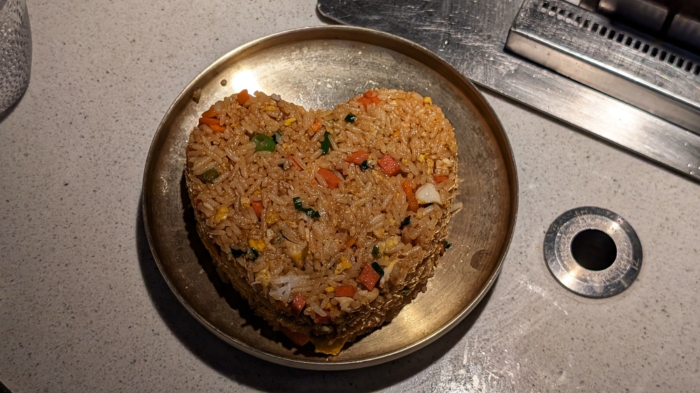 Corny presentation notwithstanding, the egg fried rice is superb. — Picture by Ethan Lau