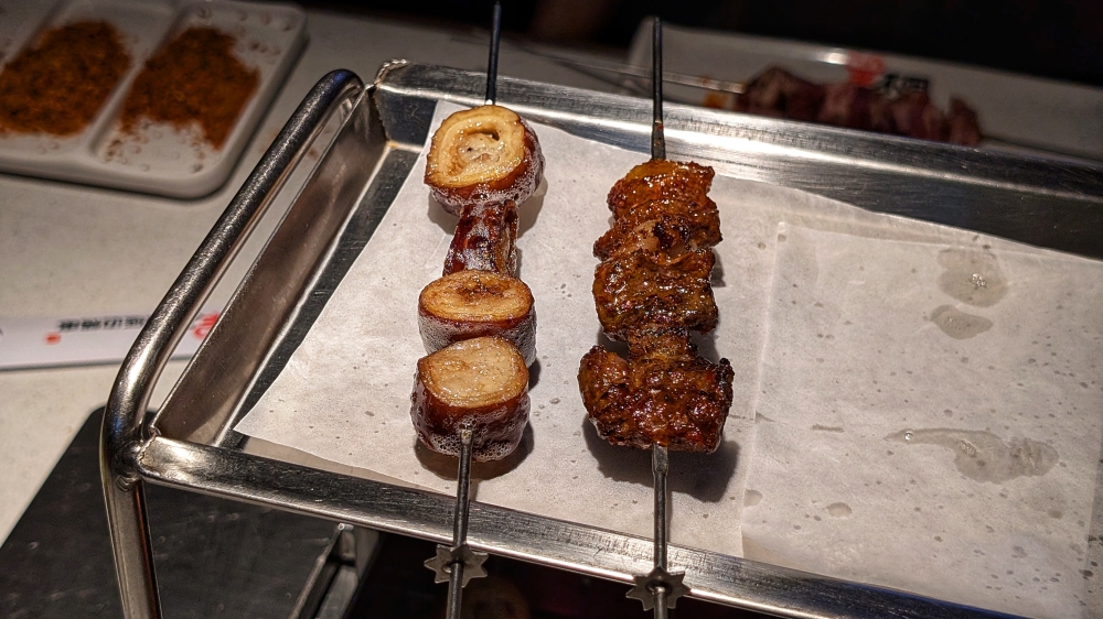 Intestine (left) may not seem like a particularly fatty skewer, but there’s loads of fat to be rendered out first. — Picture by Ethan Lau