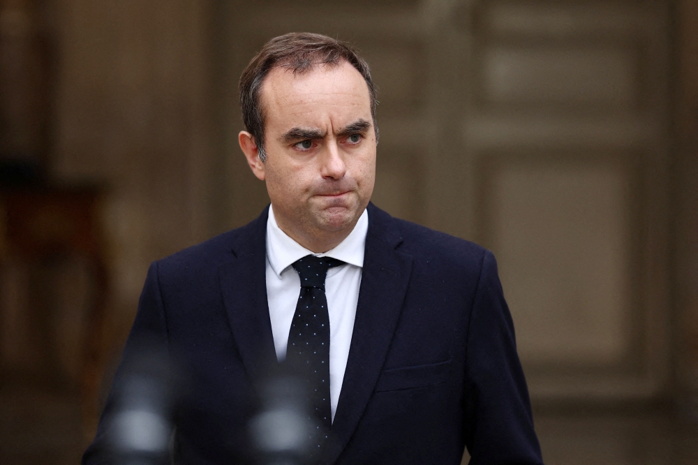 French outgoing Prime Minister Sebastien Lecornu arrives to deliver a statement at the Hotel Matignon in Paris on October 6, 2025, after President Emmanuel Macron accepted his government’s resignation. — AFP pic
