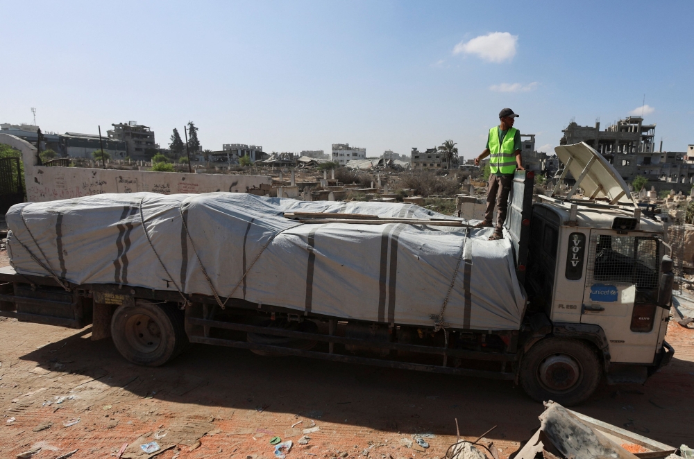 A truck carries aid for Palestinians, amid a ceasefire between Israel and Hamas in Gaza, in Khan Younis, in the southern Gaza Strip, October 11, 2025. — AFP pic 
