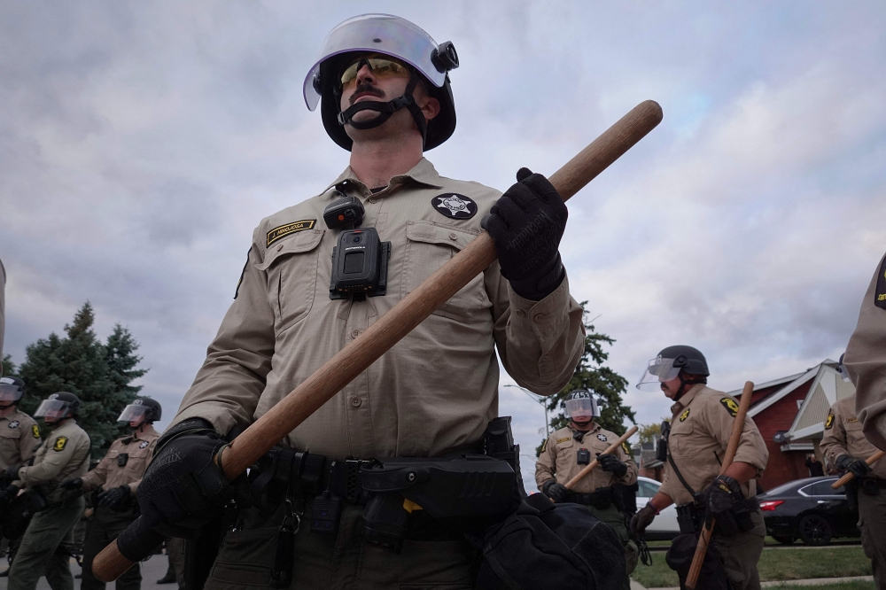 Police confront demonstrators during.a protest outside of the immigration processing and detention facility in Broadview, Illinois October 11, 2025. — Scott Olson/Getty Images North America/Getty Images via AFP