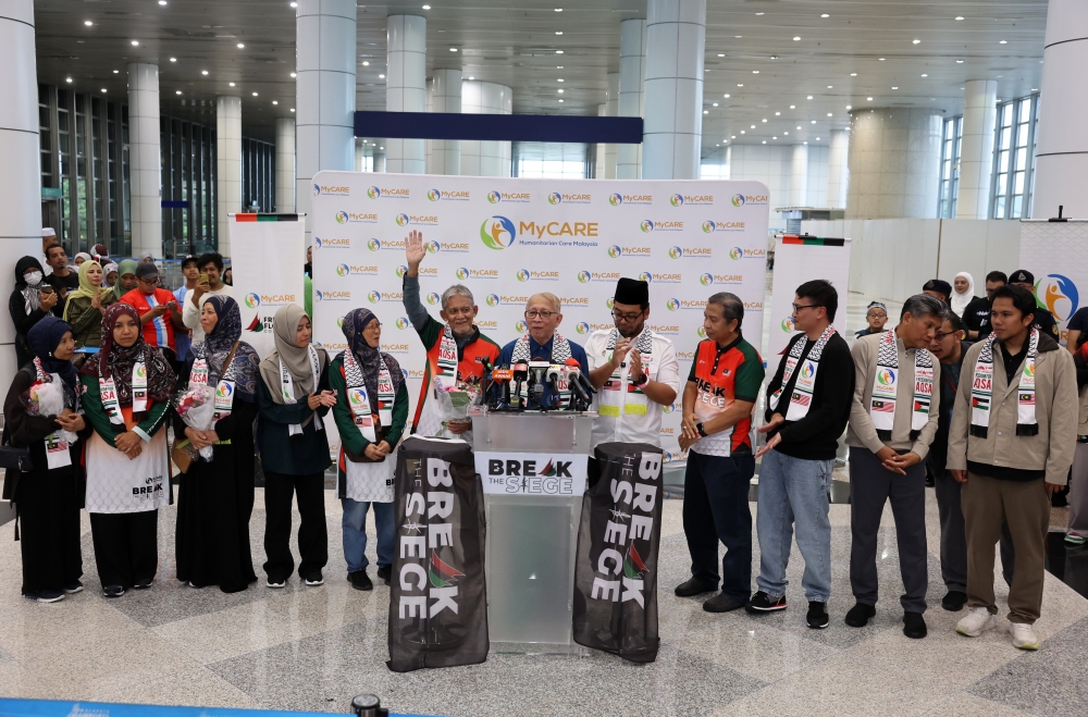 All nine Malaysian volunteers who participated in the Freedom Flotilla Coalition and Thousand Madleens to Gaza humanitarian aid missions arrived safely at Kuala Lumpur International Airport Terminal 1 October 12, 2025. — Bernama pic