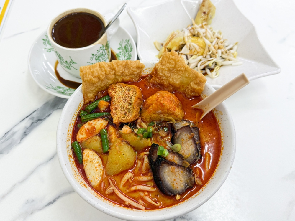 Start the day with a cup of coffee and a bowl of fragrant curry 'laksa' laden with goodies.