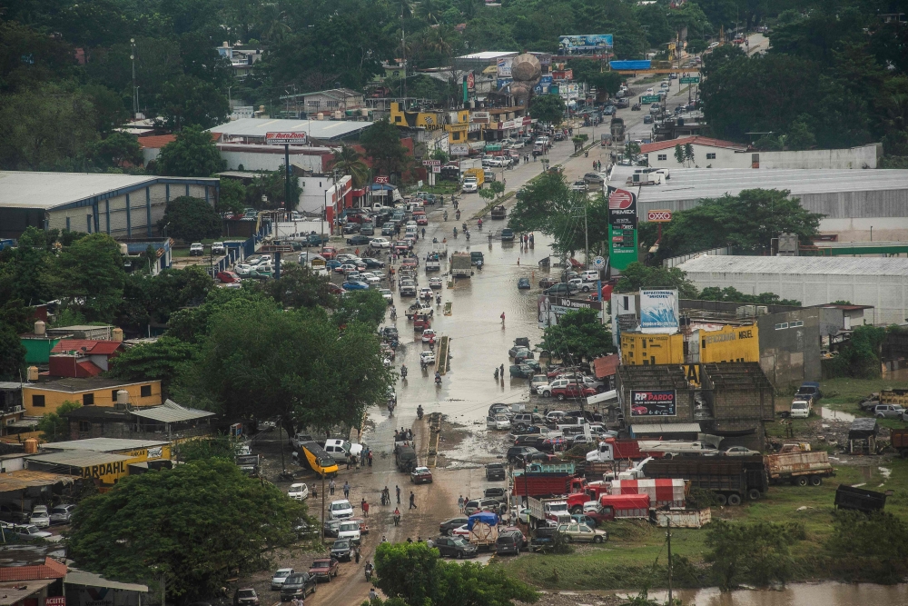 An aerial view shows flooded streets following heavy rains in Poza Rica, Veracruz state, Mexico, October 11, 2025. — AFP pic