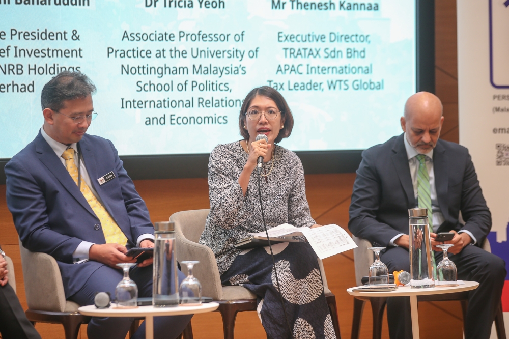 (L-R): Treasury secretary-general Datuk Johan Mahmood Merican, University of Nottingham Malaysia's associate professor Tricia Yeoh and World Bank's lead economist for Malaysia Apurva Sanghi. — Picture by Yusof Mat Isa