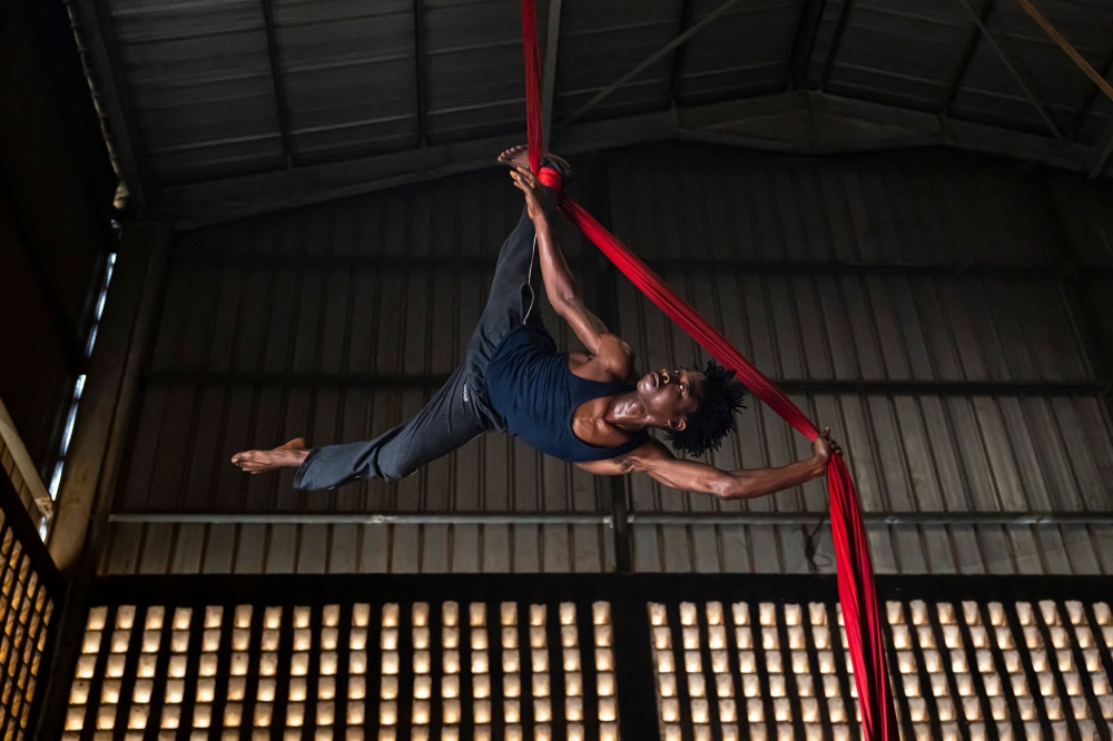 Ibrahima Oulare performs an aerial dance during practice at the Keita Fodeba Centre for Acrobatic Arts in Conakry, on September 6, 2025. — AFP pic