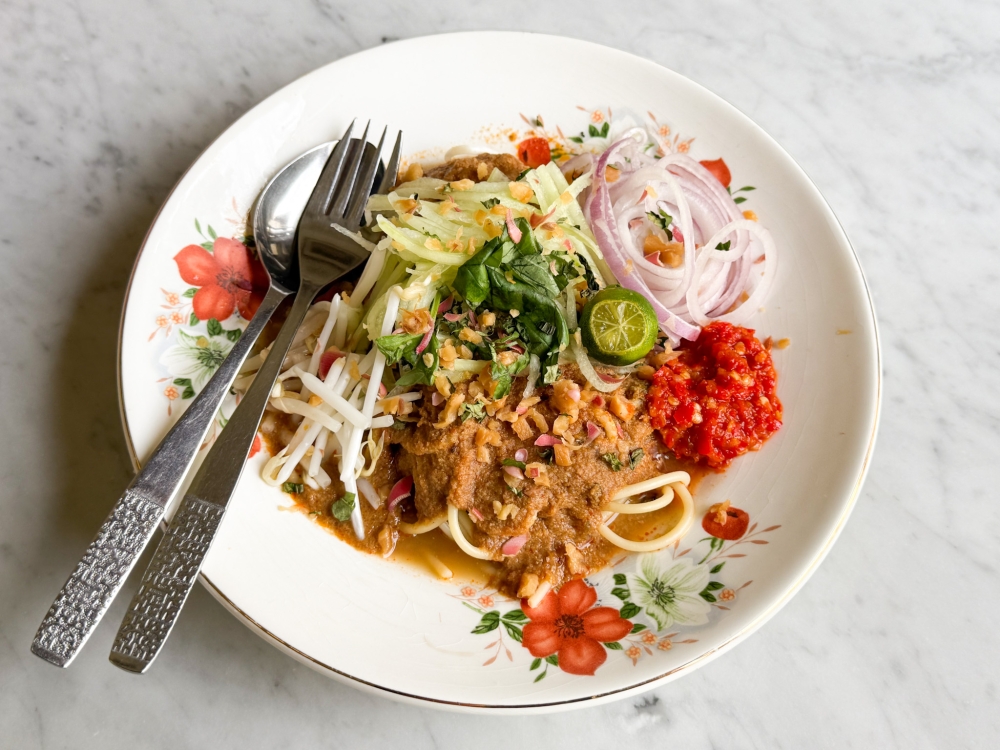 Laksa Johor Tenggiri Bunga is eaten Johorean style with a thick coconut milk gravy of fish pulp and spaghetti. — Picture by Lee Khang Yi