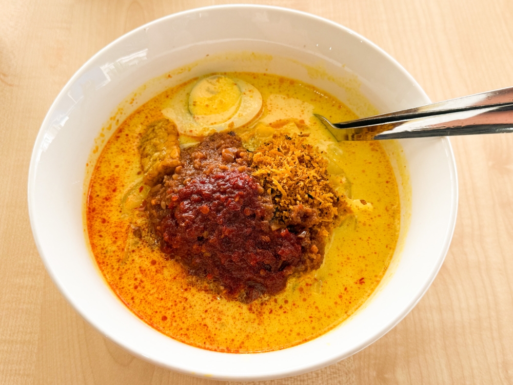 For a creamy version, Lontong Lodeh is ideal with a 'sayur lodeh' base topped with 'serunding kelapa' and 'kuah kacang' — Picture by Lee Khang Yi