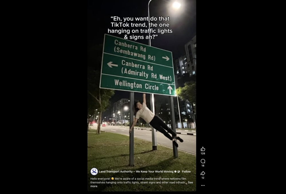 Singapore's Land Transport Authority has warned Singaporeans not to hang off signs. — Facebook screenshot