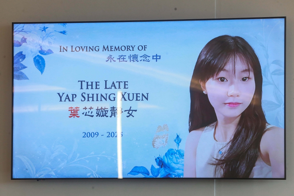 A digital display showing a memorial portrait of the late Yap Shing Xuen at her wake in Nirvana 2, Kuala Lumpur. — Picture by Sayuti Zainudin