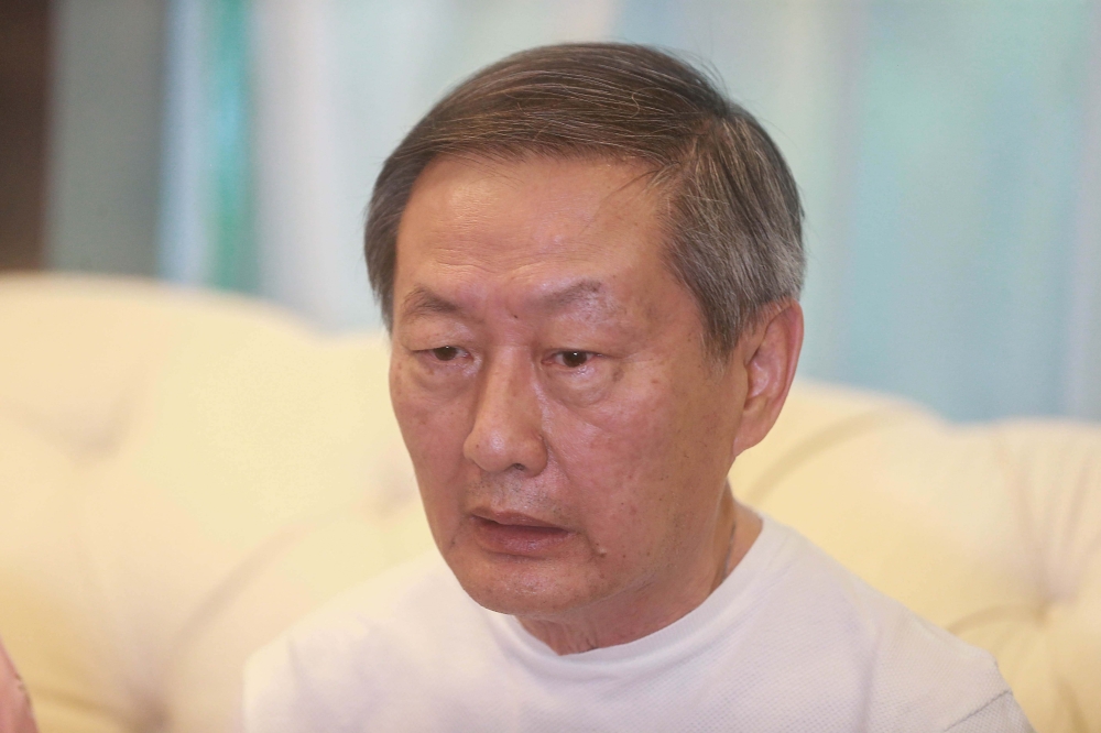 Stepfather of the late Yap Shing Xuen, How Boon Chin, speaks to the press during her wake at Nirvana 2, Kuala Lumpur. — Picture by Sayuti Zainudin