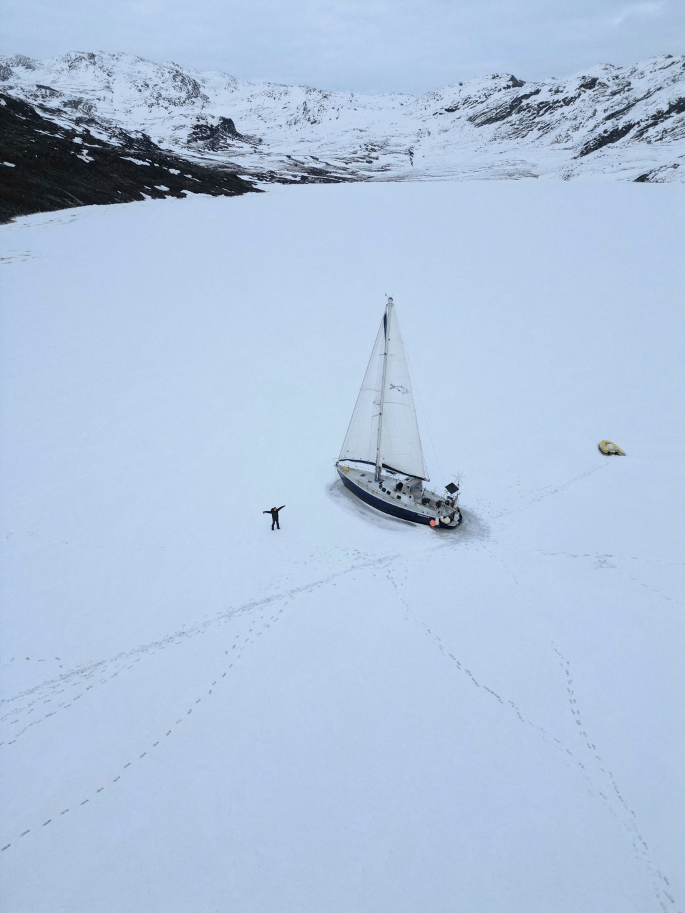 Brazilian sailor Tamara Klink next to her boat, Sardinha 2, trapped in Arctic ice in Nunavut, Canada, near the Davis Strait, north of Baffin Island and west of Greenland. — AFP pic/Courtesy of Tamara Klink
