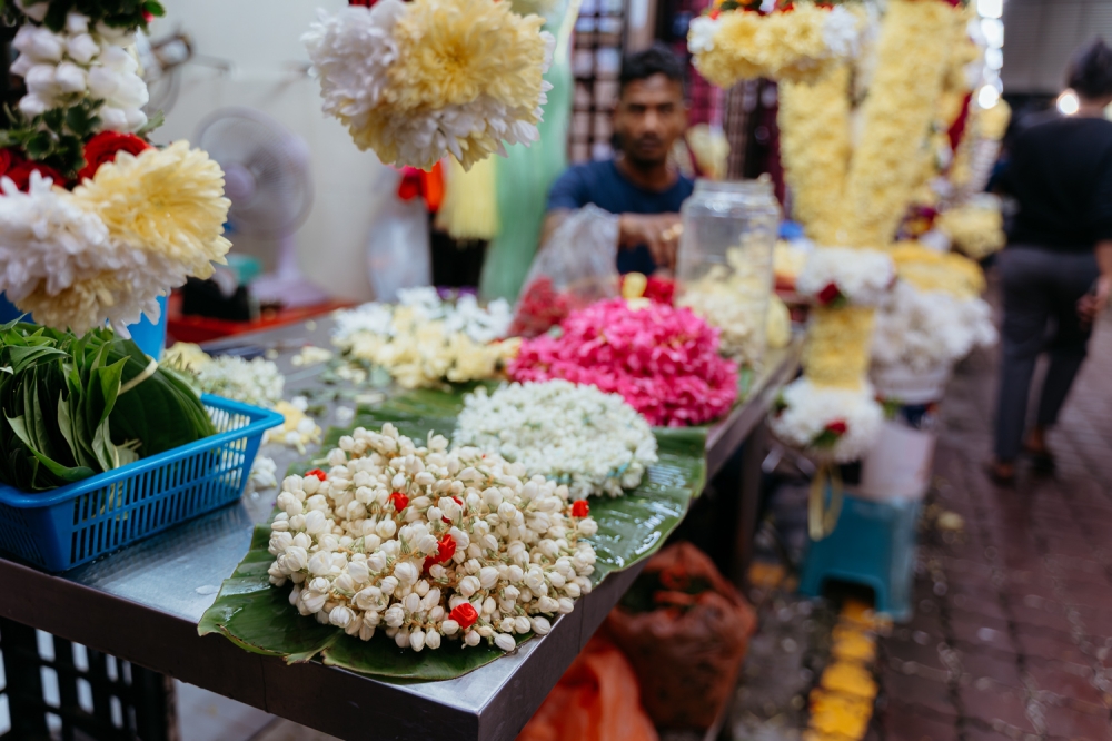 A vendor arranges fresh flower garlands at the Deepavali Bazaar in Brickfields. — Picture by Raymond Manuel