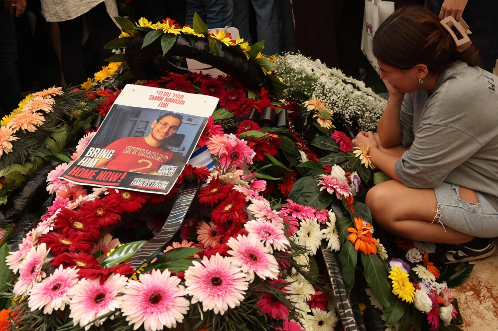 Relatives and friends mourn Israeli soldier Tamir Nimrodi, one of three hostages whose bodies were recently returned by Hamas, during his funeral in Kfar Saba on October 16, 2025. — AFP pic