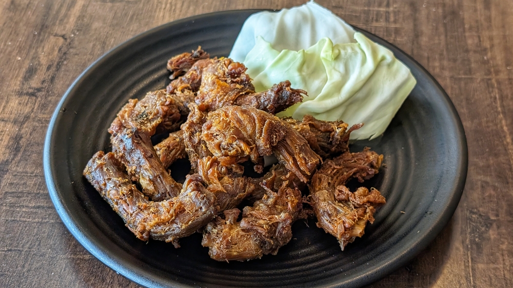 Pressure-cooked and deep-fried chicken neck makes for a chewy and crispy snack that’s plenty addictive. — Picture by Ethan Lau