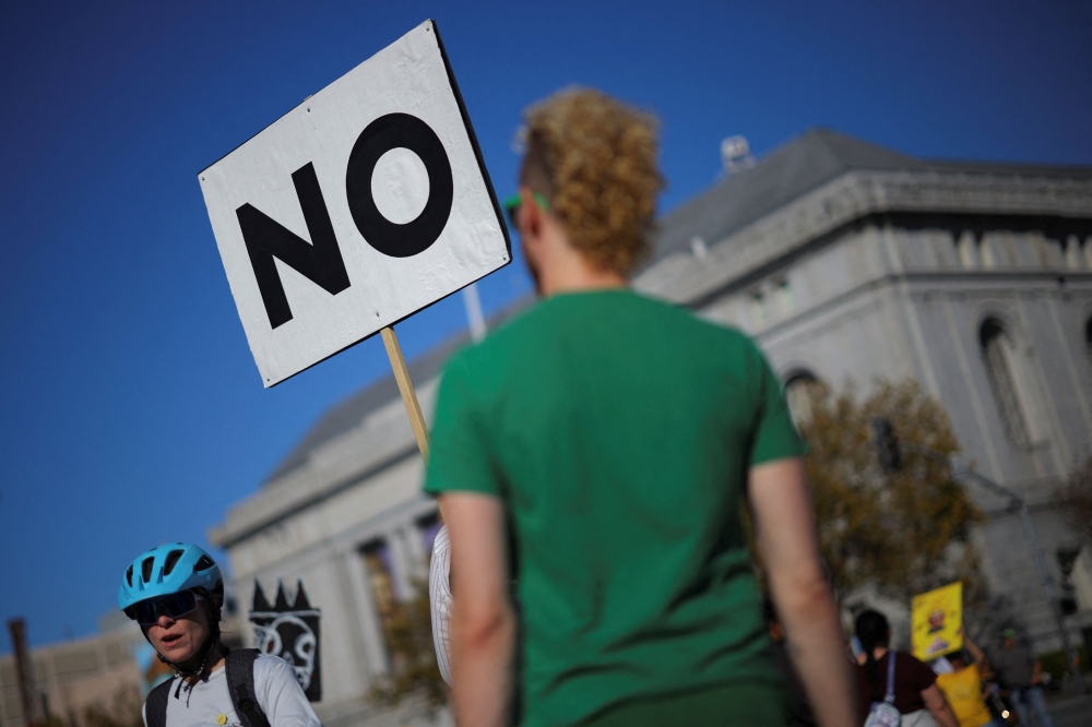 A placard that reads ‘NO’ is displayed during a ‘No Kings’ protest against US President Donald Trump’s policies, in San Francisco October 18, 2025. — Reuters pic