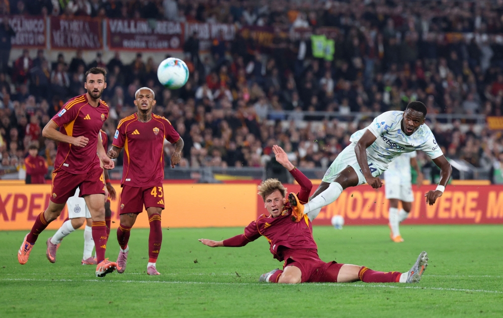 Inter Milan’s Ange-Yoan Bonny shoots at goal during their Serie A match with AS Roma at Stadio Olimpico in Rome October 18, 2025. — Reuters pic