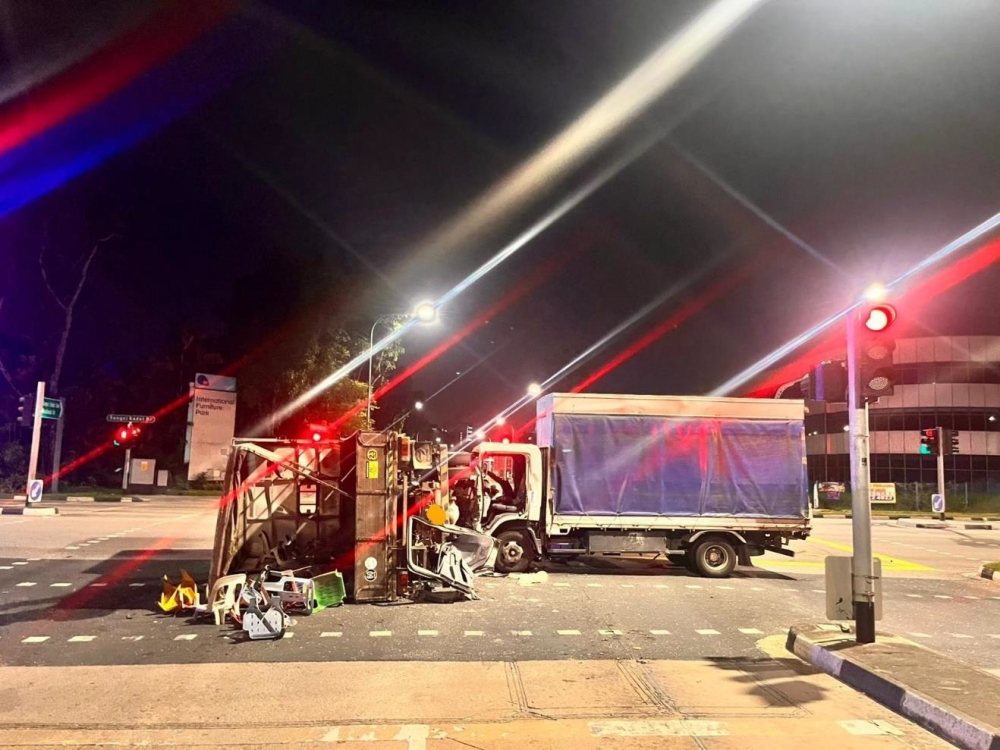 The scene of a lorry crash in Choa Chu Kang, Singapore, that left 21 injured after a driver ran a red light. — Picture via Facebook