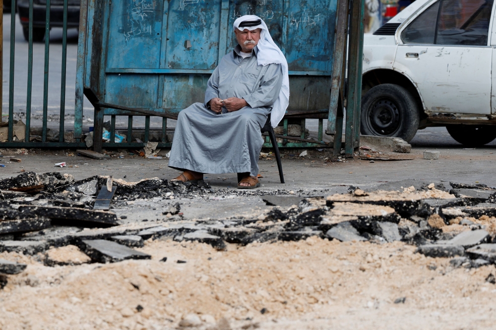 A man looks on following an Israeli raid in Tubas, in the Israeli-occupied West Bank, October 19, 2025. — Reuters pic