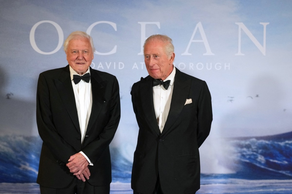 Britain’s King Charles III meets British broadcaster and biologist Sir David Attenborough upon his arrival to attend the world premier ‘Ocean with David Attenborough’ in London May 6, 2025. — AFP pic