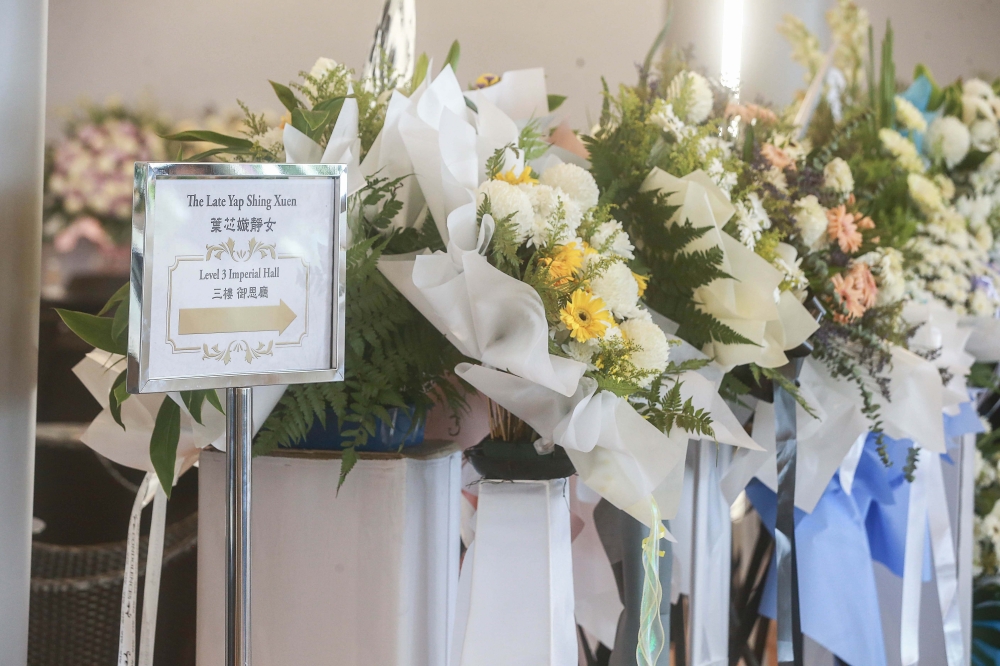 Bouquets of flowers adorn the hall at the Nirvana Center Kuala Lumpur. — Picture by Sayuti Zainudin
