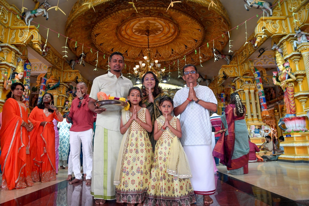 N. Sundramoorthi (right) poses for a photo with his family at the Sri Maahamariaman Devasthanam Temple in Section 7, Shah Alam, October 20, 2025. — Bernama pic 
