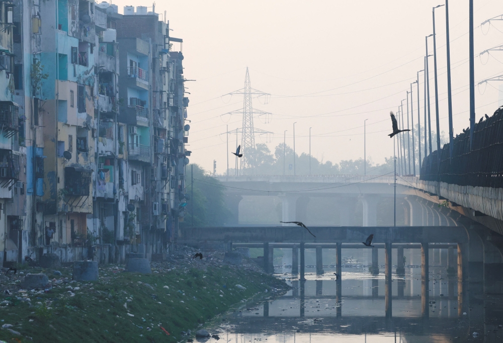 A residential area is shrouded in smog ahead of Diwali, the Hindu festival of lights, in New Delhi October 18, 2025. — Reuters pic 