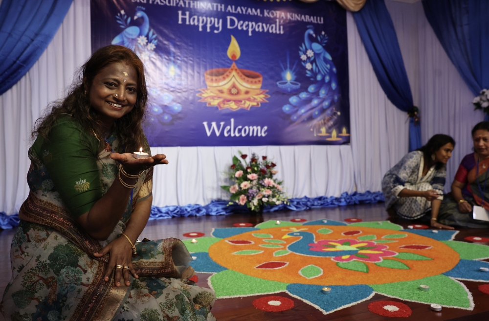 A Hindu devotee poses next to a ‘kolam’ in conjunction with the Deepavali celebration at the Sri Pusphathinath Temple in Bukit Padang in Kota Kinabalu, Sabah, October 20, 2025. — Bernama pic A Hindu devotee poses next to a ‘kolam’ in conjunction with the Deepavali celebration at the Sri Pusphathinath Temple in Bukit Padang in Kota Kinabalu, Sabah, October 20, 2025. — Bernama pic