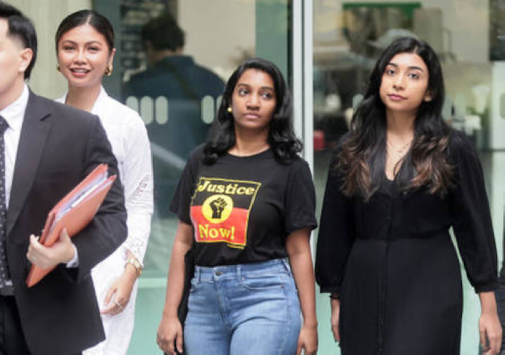 District Judge John Ng found that the trio — Annamalai Kokila Parvathi, Siti Amirah Mohamed Asrori, and Mossammad Sobikun Nahar — had acted with an ‘honest and reasonable belief’ that they were not violating regulations and noted there was no signage marking the area as restricted. — Picture from social media   