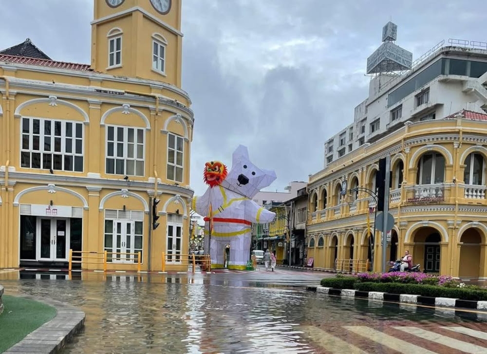 Heavy overnight rain has caused flooding across several areas in Phuket, prompting Thai authorities to rush to drain water from key locations, including near Bang Yai Canal by the Government Savings Bank at the Charter intersection, where water levels have risen sharply and are nearing the banks. — Picture from Facebook 