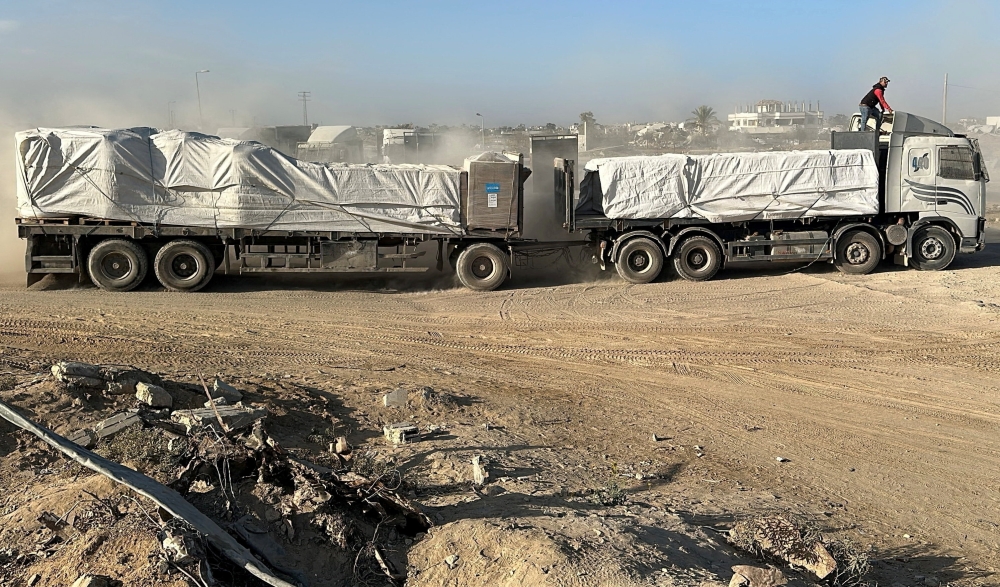 A truck carries aid for Palestinians, amid a ceasefire between Israel and Hamas in Gaza, in Deir Al-Balah, in the central Gaza Strip, October 21, 2025. — Reuters pic 