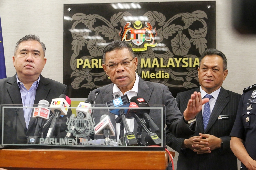 Transport Minister Anthony Loke with Home Minister Datuk Seri Saifuddin Nasution Ismail giving a press conference on aligning traffic summons compound rates between JPJ and PDRM in Parlimen Malaysia. — Picture by Choo Choy May .