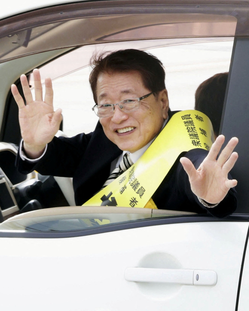 Taku Yamamoto, husband of Japan’s new Prime Minster Sanae Takaichi and former Liberal Democratic Party (LDP) Lower House lawmaker, waves from a car during a campaign in Sabae, Fukui Prefecture, October 15, 2025 in this photo taken by Kyodo. — Kyodo pic via Reuters