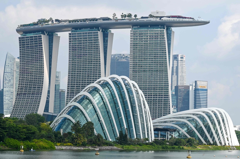 A Chinese man was sentenced to six days’ jail in Singapore for molesting a woman in a Marina Bay Sands lift while accompanied by his wife. — AFP pic
