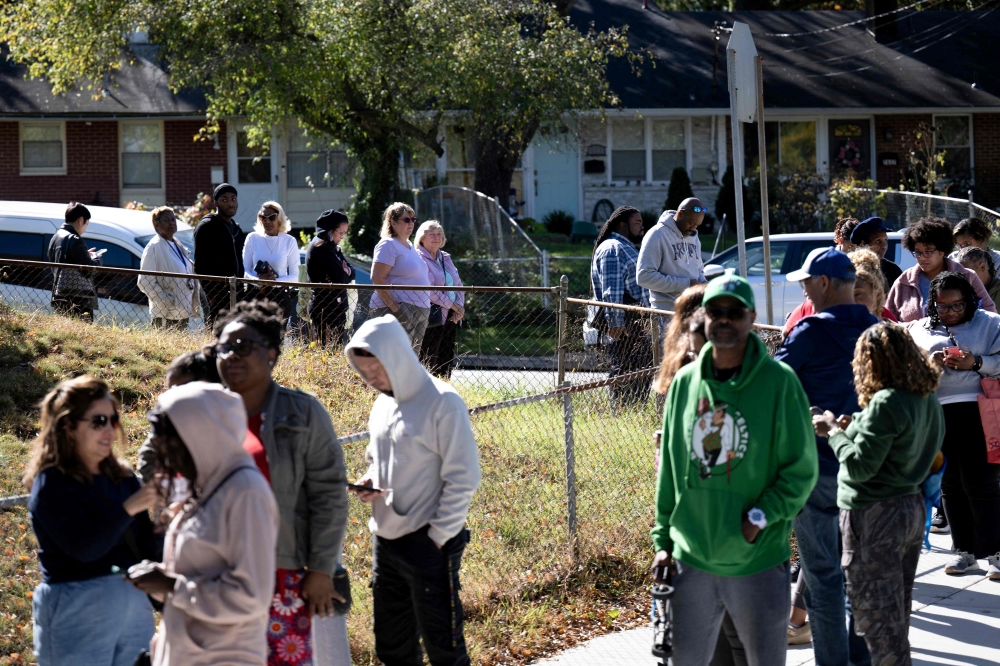 People line up to receive food for furloughed federal workers at No Limits Outreach Ministries on October 21, 2025 in Hyattsville, Maryland. — AFP pic 