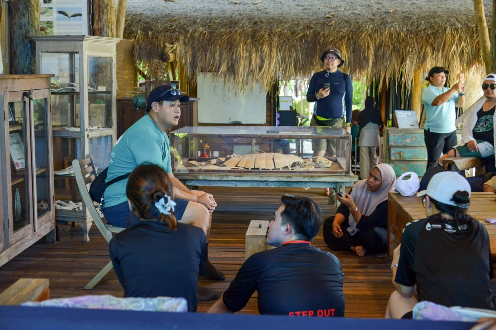 Pulau Tengah Conservation Centre Officer Cheng Si Va shares information about turtle conservation efforts at the Tunku Abdul Jalil Conservation Centre (TAJCC) on Pulau Tengah, October 23, 2025. — Bernama pic