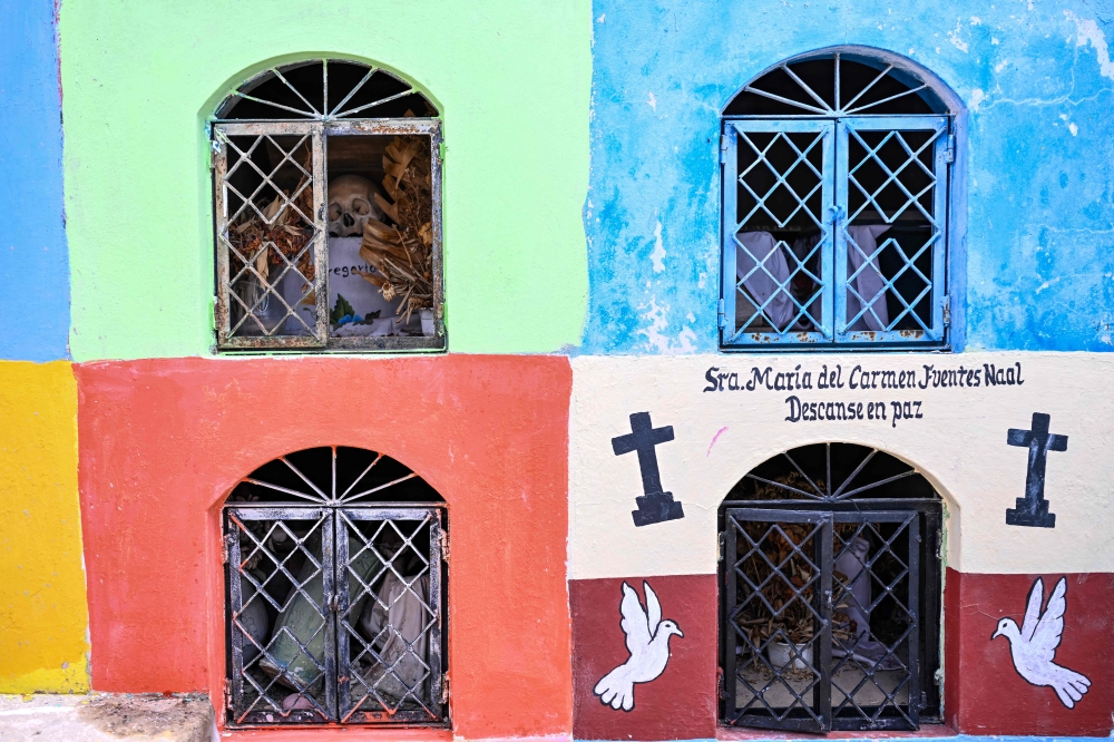 The remains of a person are pictured inside an ossuary before being cleaned by relatives ahead of the Day of the Dead celebrations at the Pomuch cemetery, Campeche state, Mexico on October 18, 2025. — AFP pic