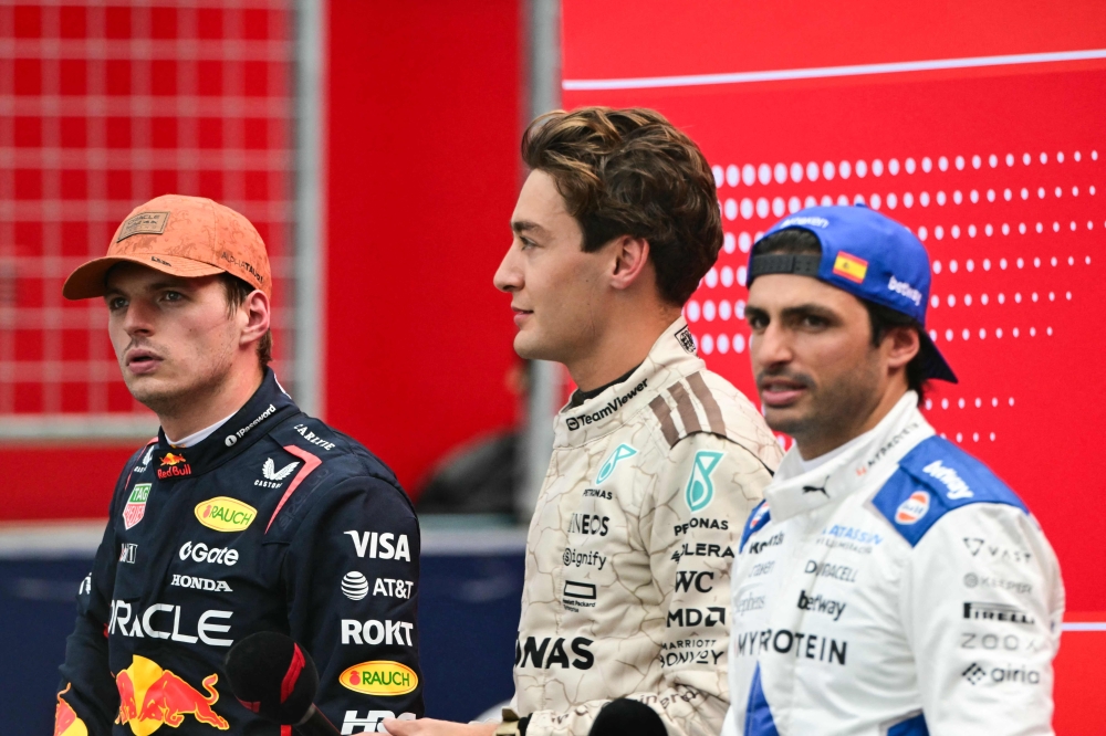 (L-R) First place finisher Red Bull Racing’s Dutch driver Max Verstappen, second place finisher Mercedes’ British driver George Russell and third place finisher Williams’ Spanish driver Carlos Sainz stand on the podium after the United States Formula One Sprint at the Circuit of the Americas in Austin, Texas, on October 18, 2025. — AFP pic