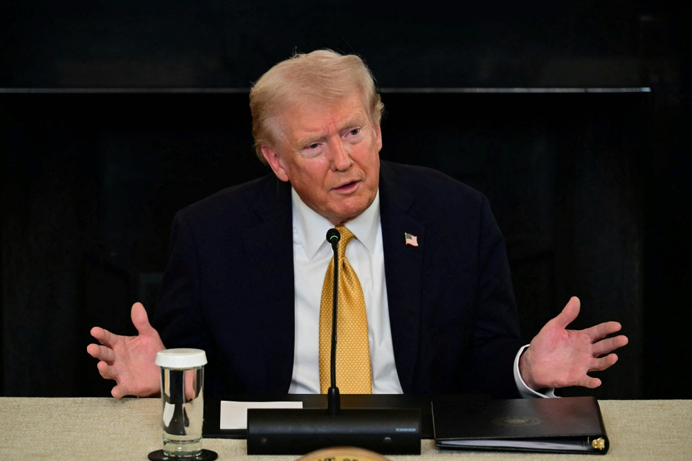 US President Donald Trump speaks during a law enforcement roundtable in the State Dining Room of the White House on October 23, 2025 in Washington, DC. — AFP pic 