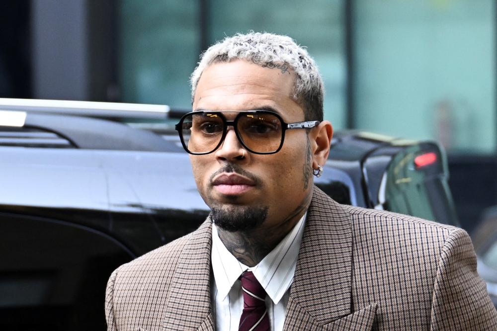 US singer Chris Brown appeared in the dock alongside his co-defendant Omololu Akinlolu, 38, who has also previously denied the charges against him. The pair’s trial is due to begin in October 2026. — Reuters pic