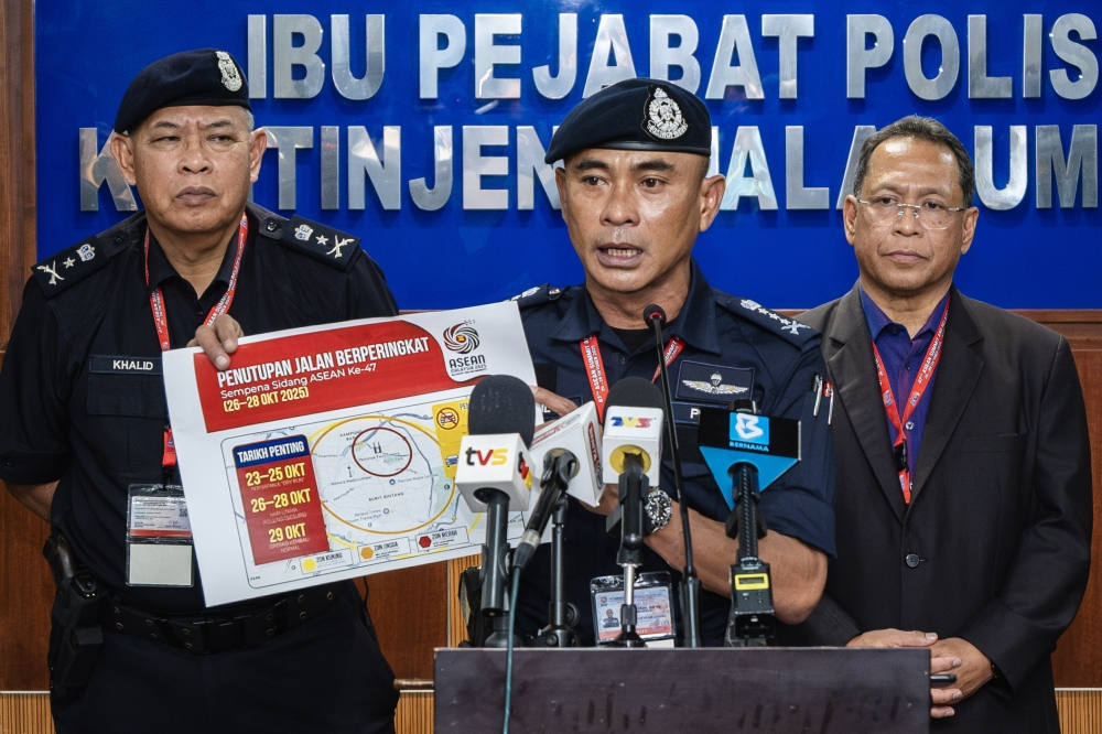 Kuala Lumpur police chief Datuk Fadil Marsus points out a road closure location during a press conference at the Kuala Lumpur Police Contingent Headquarters in Kuala Lumpur October 25, 2025. — Bernama pic