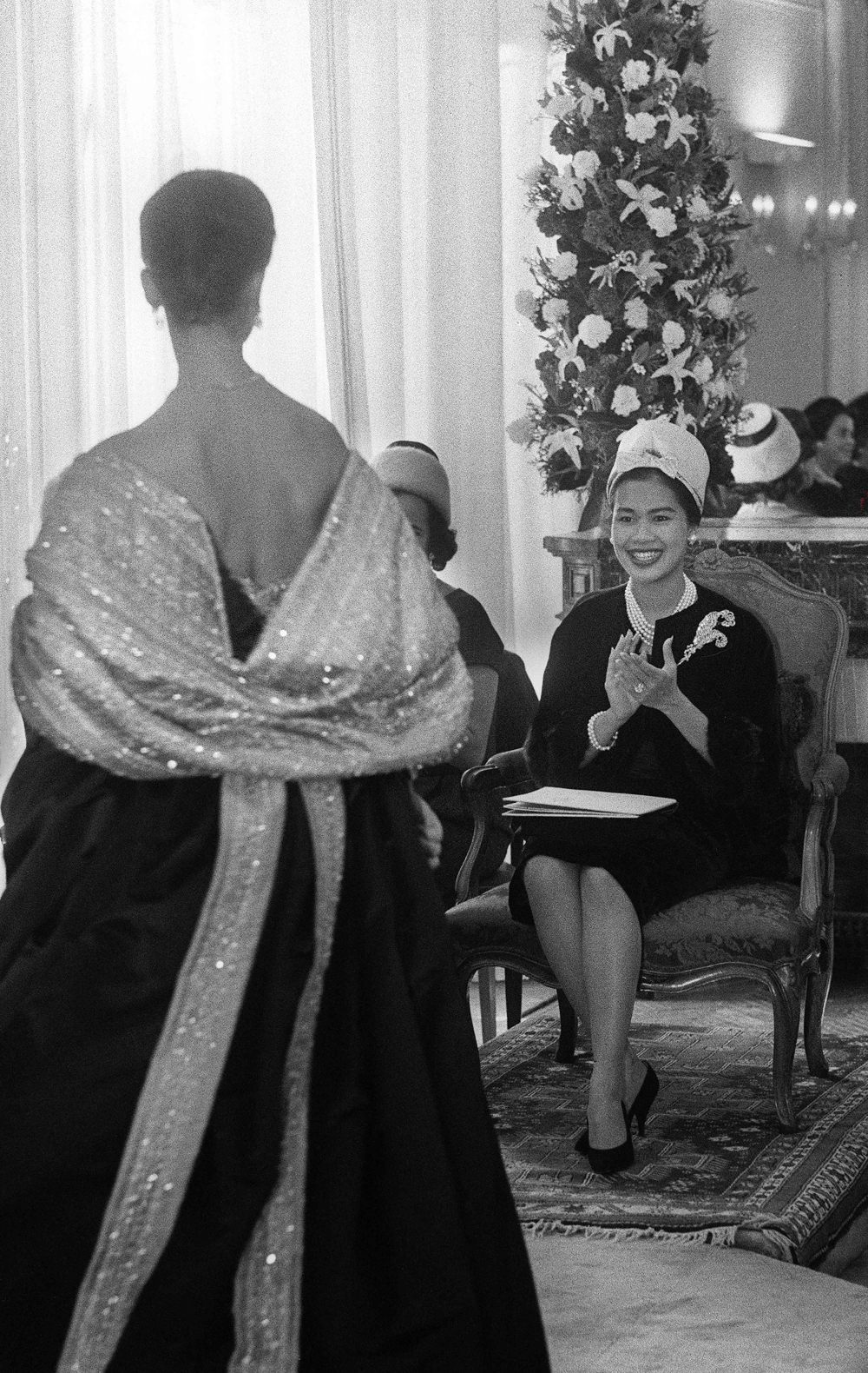 Queen Sirikit of Thailand attends a haute couture fashion show at the Pierre Balmain designer house in Paris October 12, 1960. — AFP pic