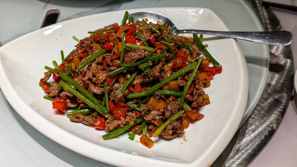 Stir-fried beef features the sharp flavour of Chinese celery and piquant punch of pickled chillies. — Picture by Ethan Lau 